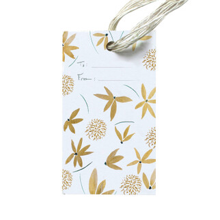 Gift tag with gold flowers across all of it to and from written in nice handwritting.